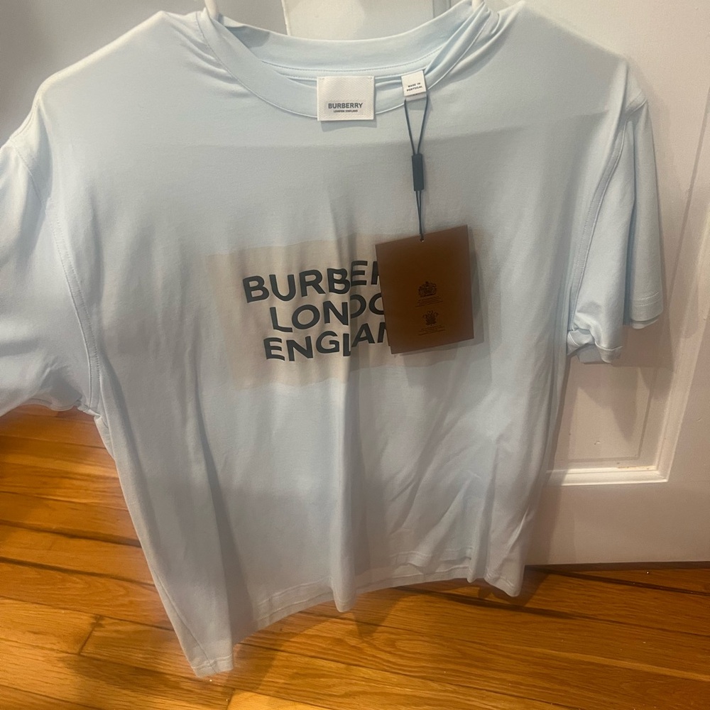 Burberry logo women’s shirt brand new with tags. Baby blue XS in size.